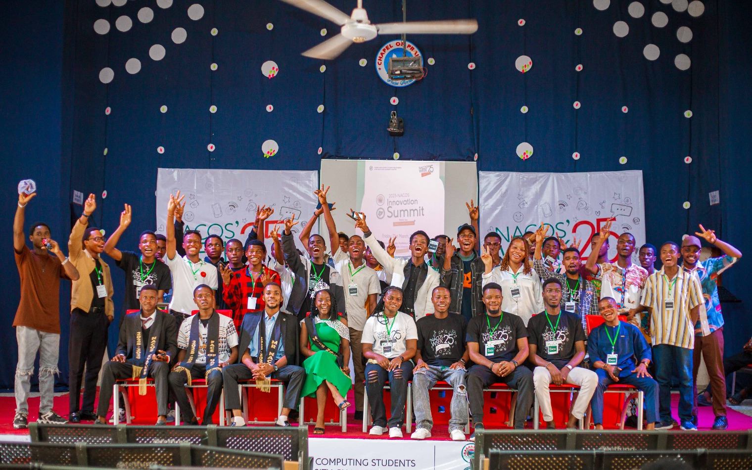 Students and NACOS executives celebrating on stage at NACOS Week 2025
