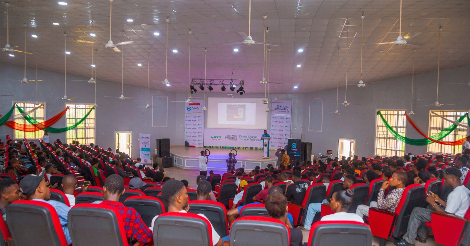 A full hall facing the stage