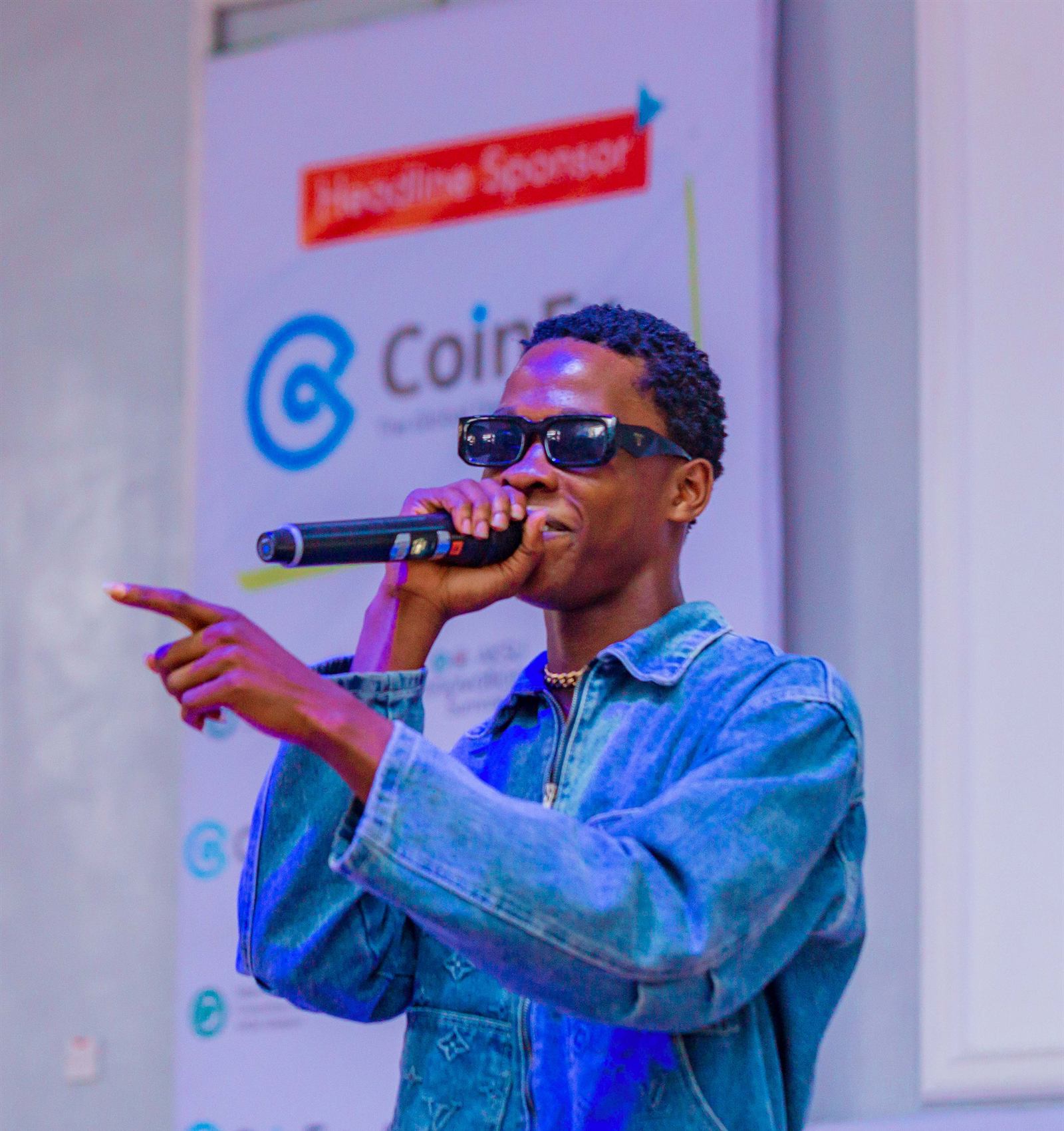 A performer on stage with a microphone